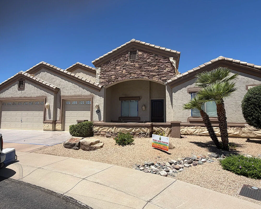 Stone archway masked and protected before exterior painting in Sun City, AZ