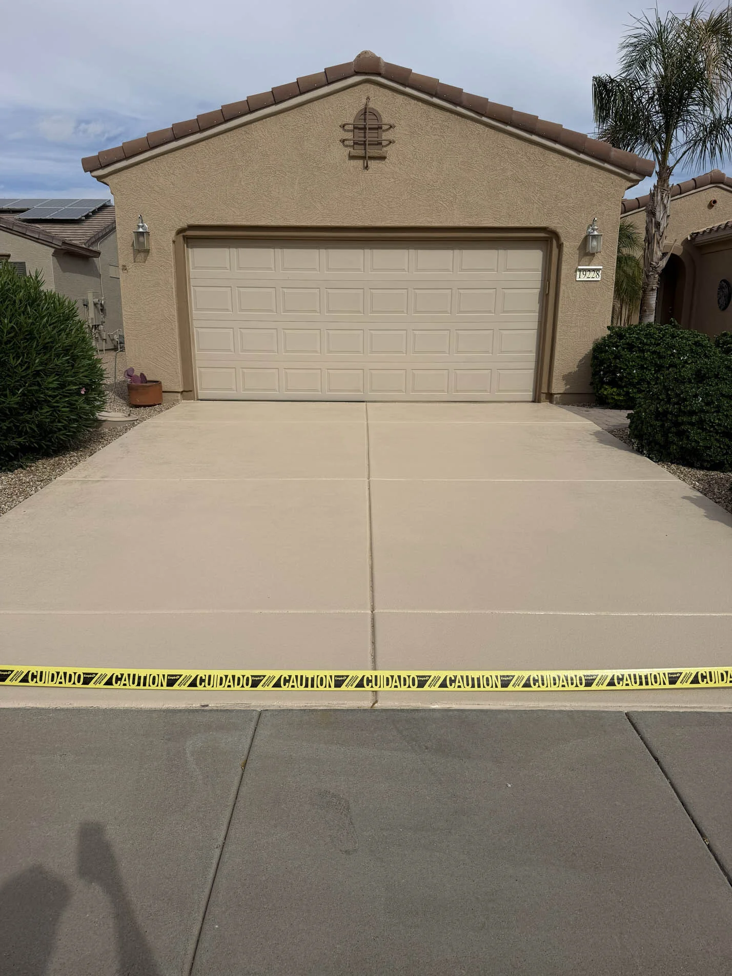 Freshly applied tan Kool Deck driveway coating in Surprise, AZ