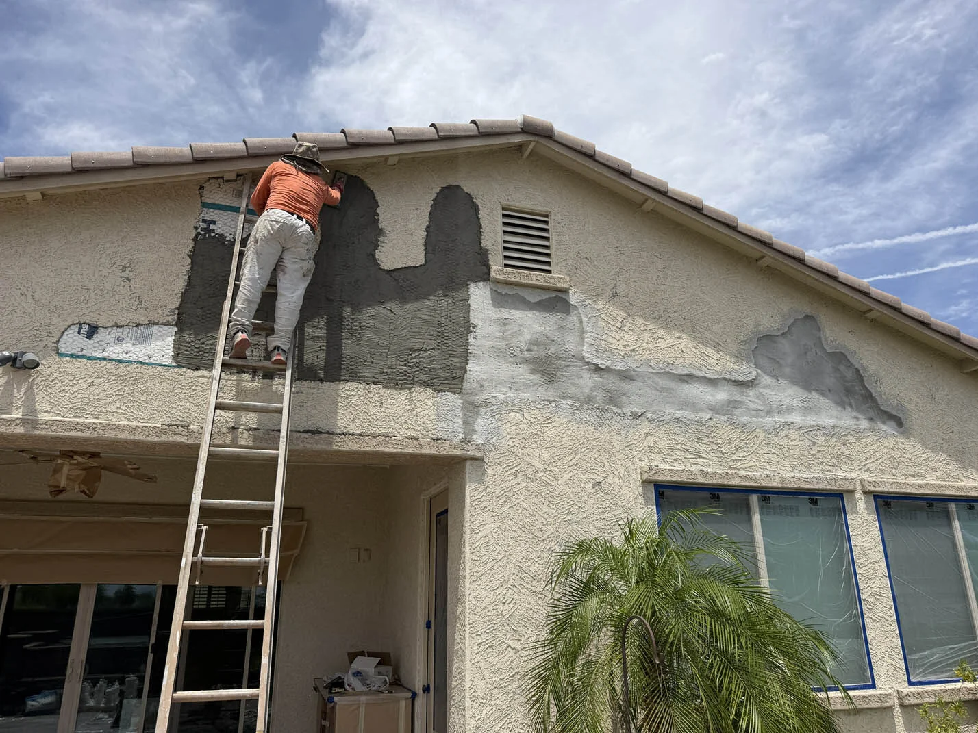 Flat Roof Coating work in progress on a West Valley home in Phoenix, AZ