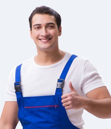 Smiling male painter in blue overalls giving a thumbs up, representing quality craftsmanship and customer satisfaction at Desert Mesa Painting.